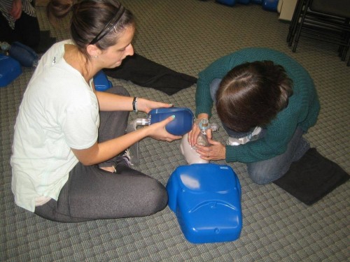 Practise using pocket mask-and bag valvemask in CPR course in Kelowna First Aid